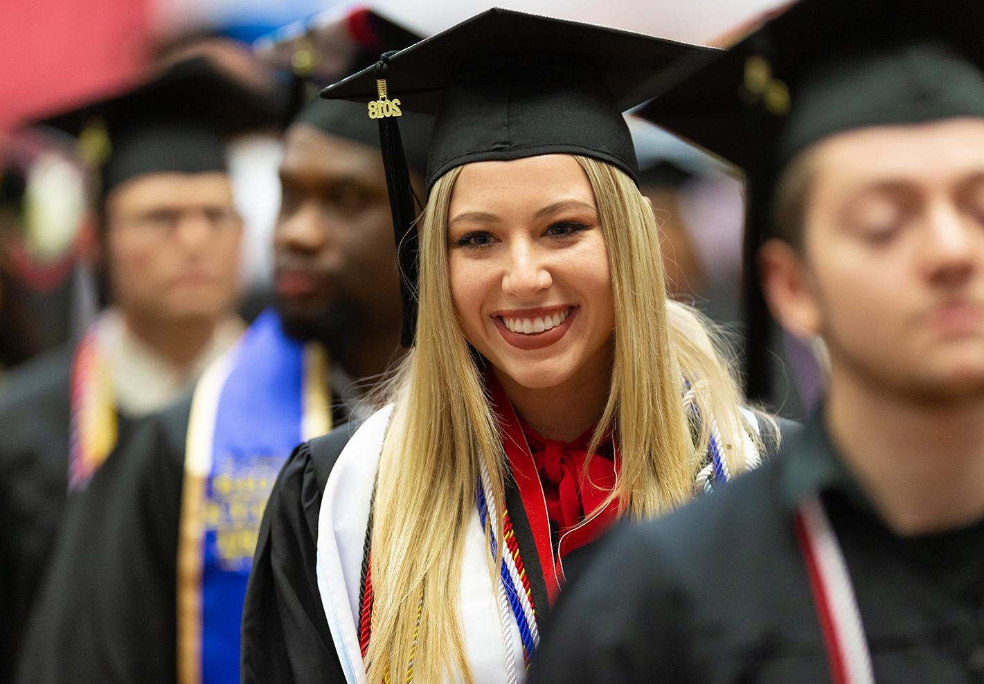 Alexis Larkin walks through graduation line